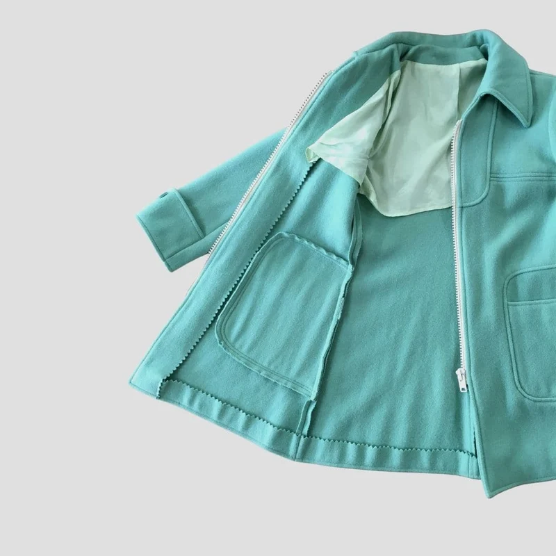 Manteau vert d'eau au zip blanc - Seconde main